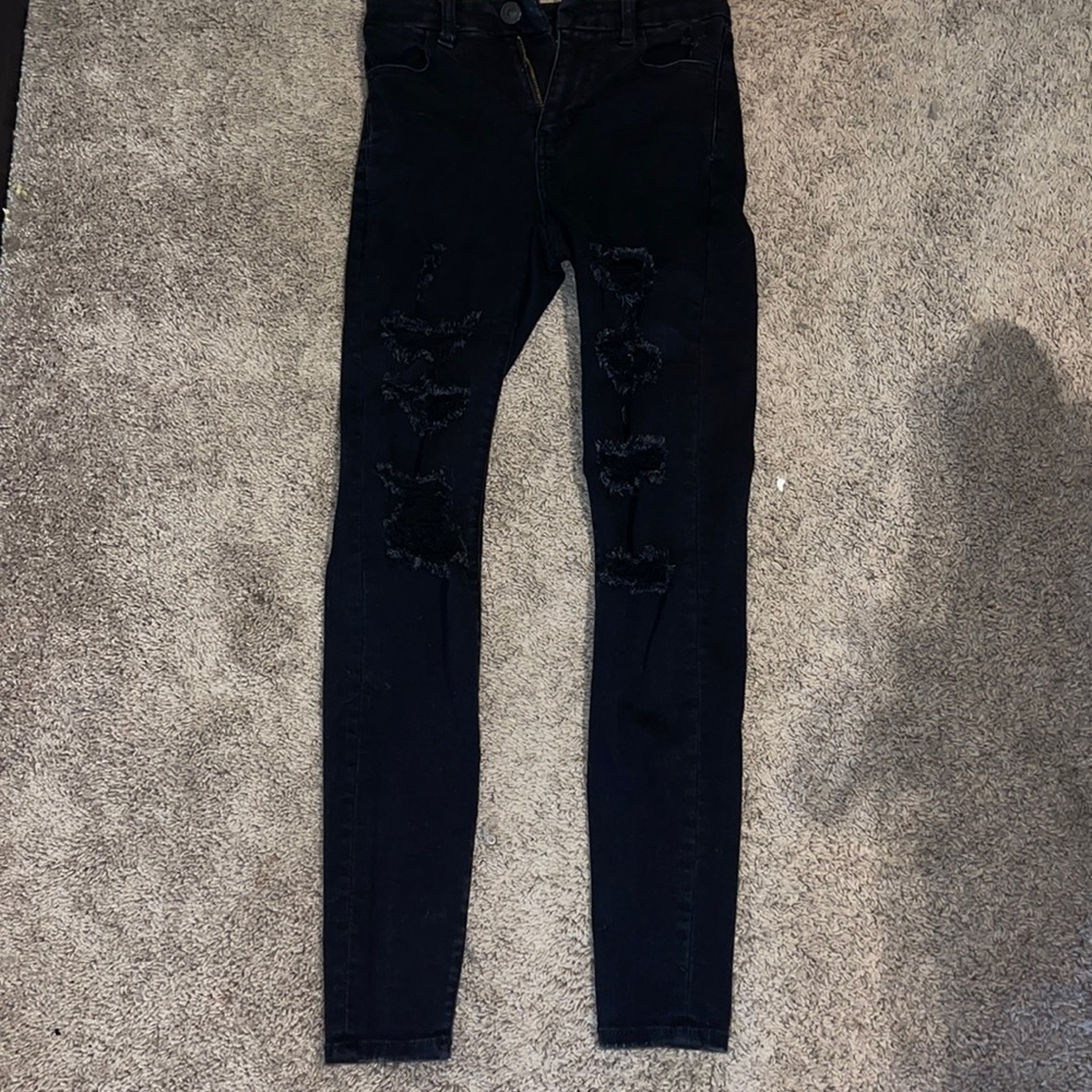 Black distressed skinny jeans